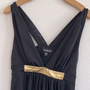 Bebe dress in size XS 93% polyester and 7%spandex side drapes  fits beautifully